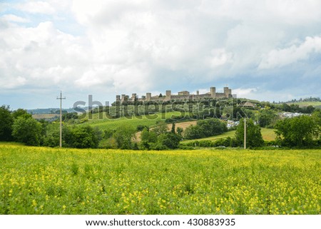 Monteriggioni town fortified by medieval stone walls on the hills of Siena in the Chianti area in Tuscany. in the image there are no trademarks or recognizable people