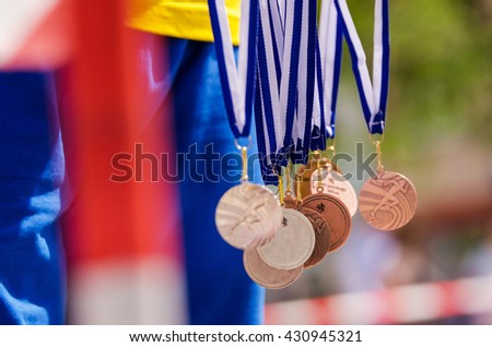Gold, silver and bronze metal in the air. Nice background for Rio olympic time Royalty-Free Stock Photo #430945321