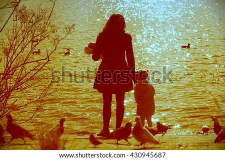 Happy Beautiful  Family Having Fun Outdoors on the Dawn Time.