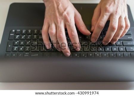 Man's hands on laptop. Business man work on computer
