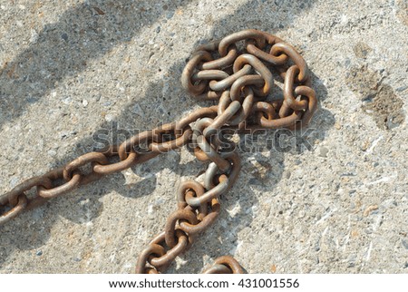 rusty chain on concrete
