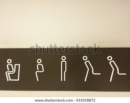 The bathroom symbol on wall background with copy space.