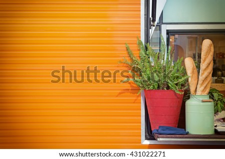 Orange Container wall with  flowerpot and bread ,Space for text.
