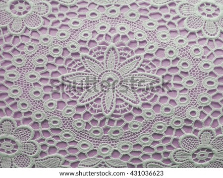White mat crotch doilie over violet background