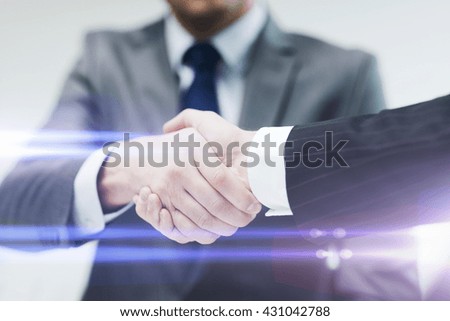 businesss and office concept - two businessmen shaking hands in office Royalty-Free Stock Photo #431042788
