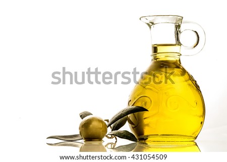 Extra virgin olive oil glass jar and olive isolated on white background Royalty-Free Stock Photo #431054509