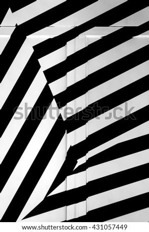 Abstract white and black-colored background. Which uses parallel lines, creating a mesmerizing effect. 
