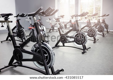 Healthy lifestyle concept. Spinning class with empty bikes. fitness, sport, training Royalty-Free Stock Photo #431085517