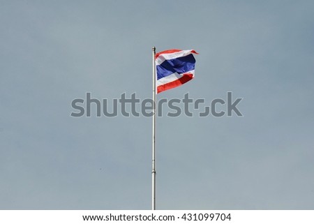 Thailand waving flag flew atop the flagpole on blue sky