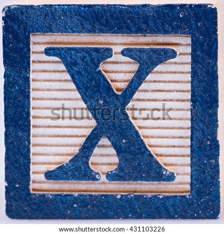 Letter X old wooden painted block