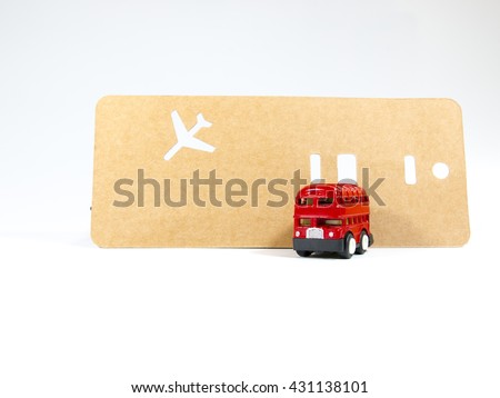 Mini double desk bus with travel tag on white background with aircraft sign of London England