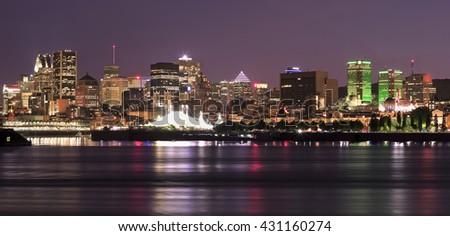 Montreal skyline and St Lawrence River at night 