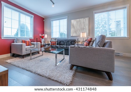 Luxury modern living suite, room with sofa and chairs, nicely decorated with vase and a coffee table. Interior design.