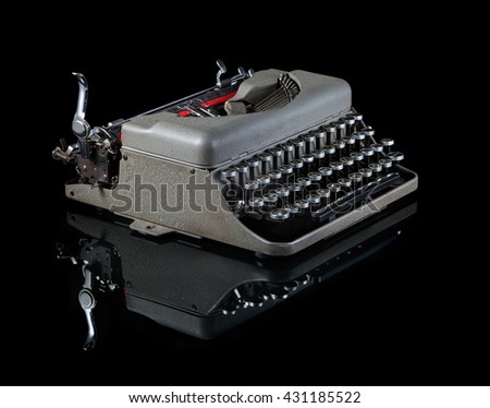 Vintage typewriter isolated on black background