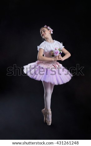 Ballerina  is dancing on a black background