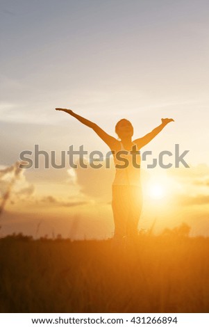 Young woman raise hands up for her success, Concept of Success in life.
