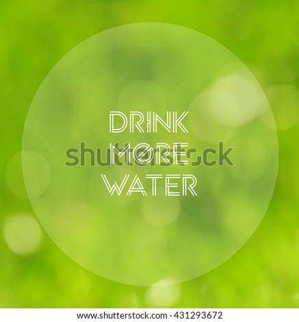 Inspirational quote on blurred background with phrase "Drink more water"