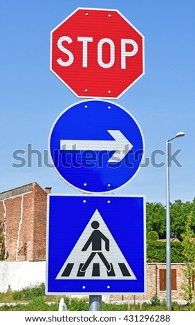 Stop sign at the pedestrian crossing in the city