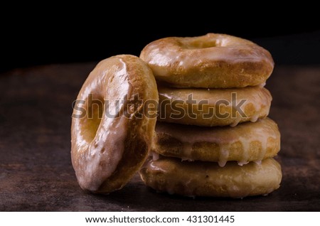 Homemade donuts with sugar and chocolate, rustic dipped