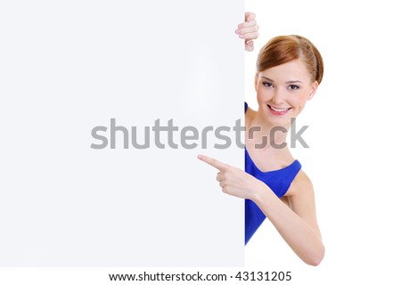 Beautiful happy woman points on message on the blank banner - isolated on white