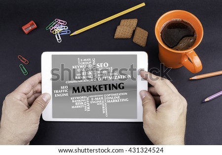 MARKETING word cloud. Text on tablet device