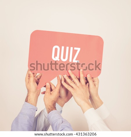 A group of people holding the Quiz written speech bubble