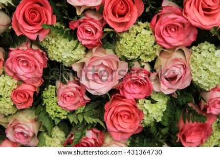 Bridal decorations: different shades of pink roses and white, green hydrangea