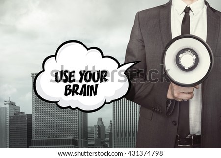 Use your brain text on speech bubble with businessman and megaphone