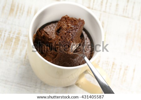freshly baked chocolate mug cake Royalty-Free Stock Photo #431405587