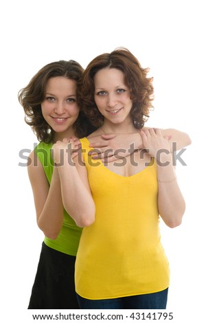 Picture of happy two sisters In colorful clothes, isolated on white background