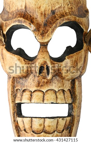 Handmade wooden carved creepy skull death joker mask on white background