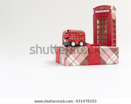Gift to go to London with red bus and telephone booth  on white background. London, the capital of England and the United Kingdom, is a 21st-century city with history stretching back to Roman times. 