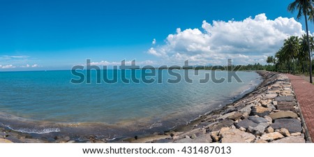 Panoramic scenic view of the beach sidewalk along the coast of Negara with Java Island in the background. Indonesia