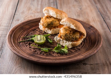 Vada Pav OR Wada Pao is Indian OR Desi Burger, is a roadside fast food dish from Maharashtra. Selective focus Royalty-Free Stock Photo #431496358