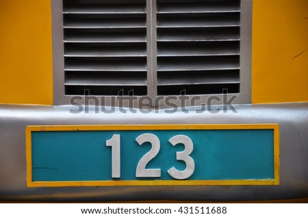 Number plate with 123 number on green background