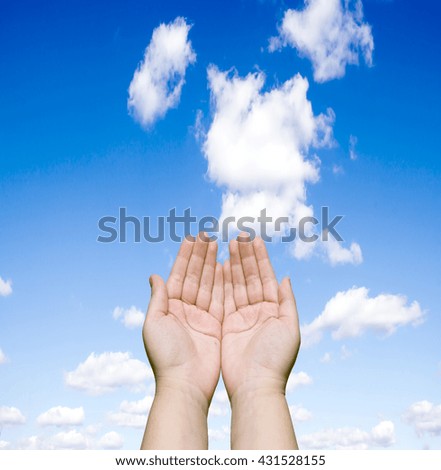 two human hands against the blue sky