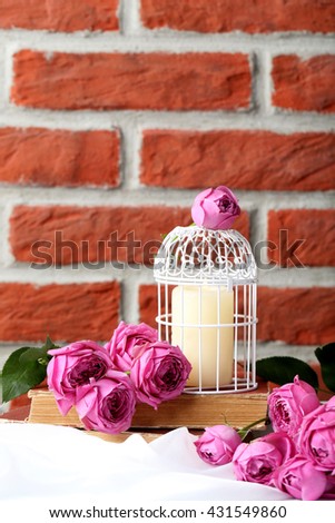 Beautiful pink roses on a brick wall background