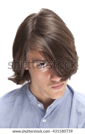 portrait of teen with long surfer haircut isolated on white, focus on hair