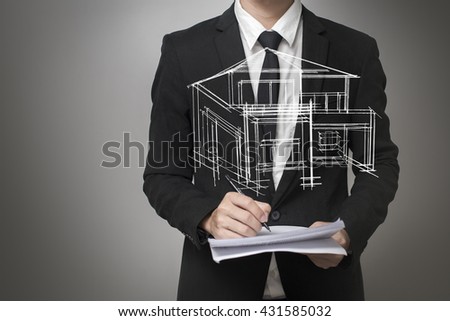 Businessman drawing a model of the house