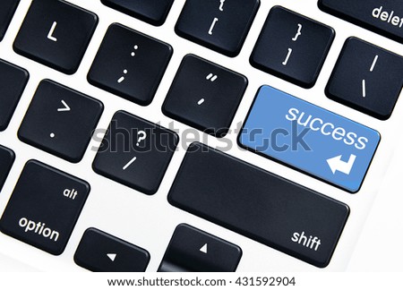 Closeup picture of success button on a modern keyboard.