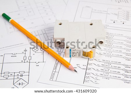 Science, technology and electronics. Electrical engineering drawings printing with pencil and circuit breaker. Scientific development.