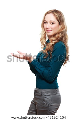young excited woman standing happy smiling holding her hand showing something on the open palm
