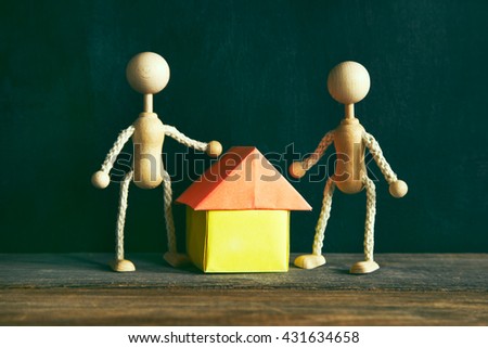 wooden little men building new house