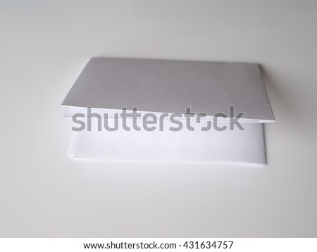folded paper on a gray background