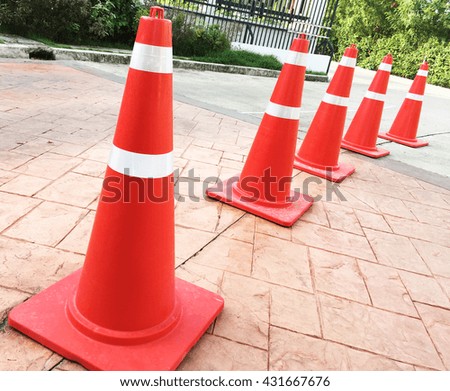 orange traffic cones on the floor