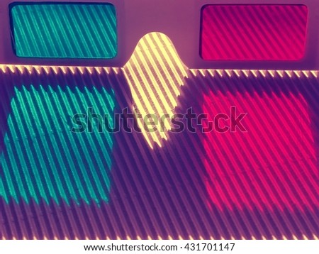 Stereo glasses, red - blue (turquoise - crimson) close-up on a corrugated surface. Macro, detail.