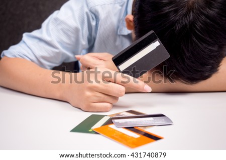 holding a credit card - debt with spending Royalty-Free Stock Photo #431740879