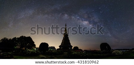 Outstanding high contrast of milky way with star blooming with Silhouette flower garden, waterfall and pagoda on Inthanon mountain, thailand, panorama picture