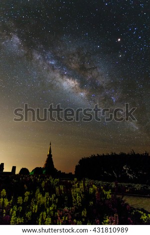 Outstanding high contrast of milky way with star blooming with Silhouette flower garden, brick road and pagoda on Inthanon mountain, thailand, vertical picture