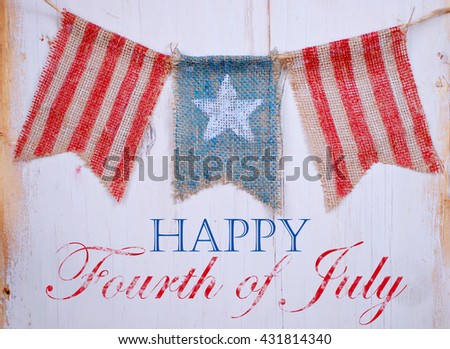 Rustic patriotic banner of three painted burlap flags on white washed wooden background. Center is white star on blue. Outside is red and white stripes with July 4th text